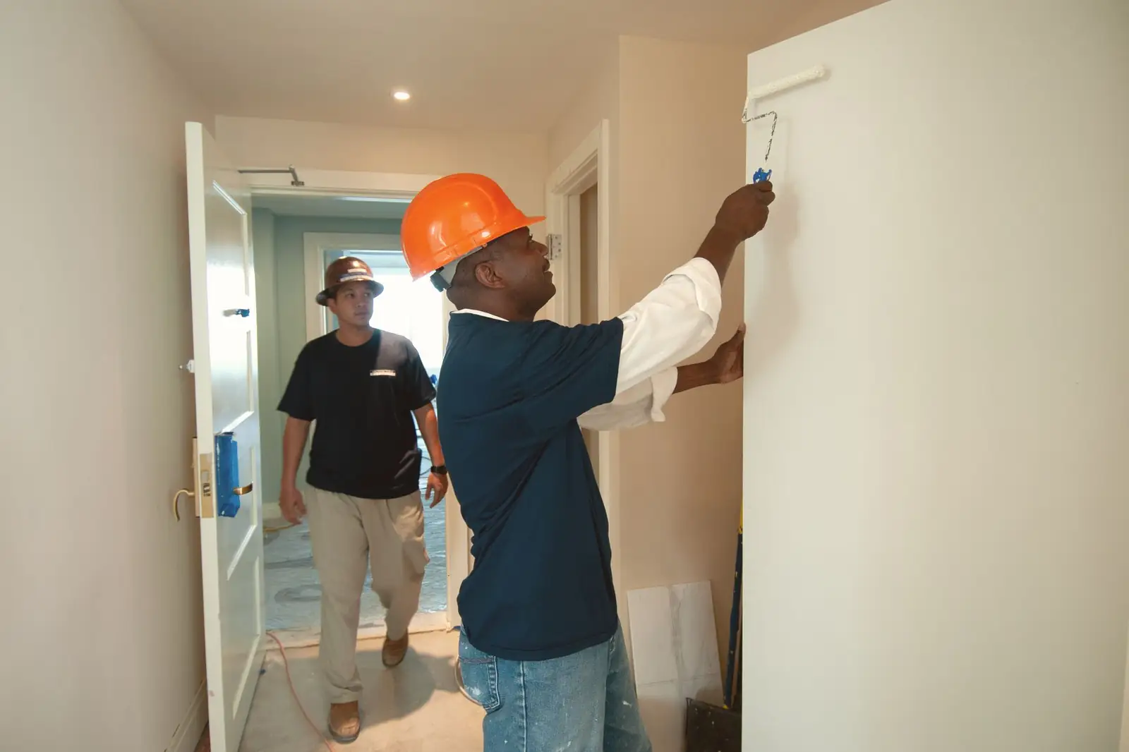 Crew repainting an interior
