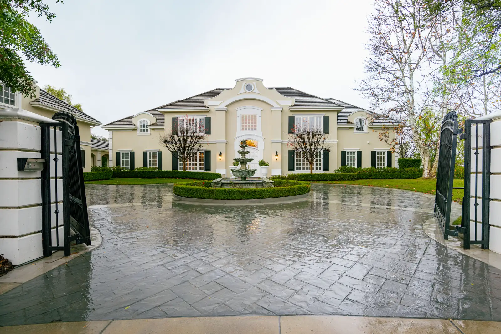 Gated estate entrance with fountain